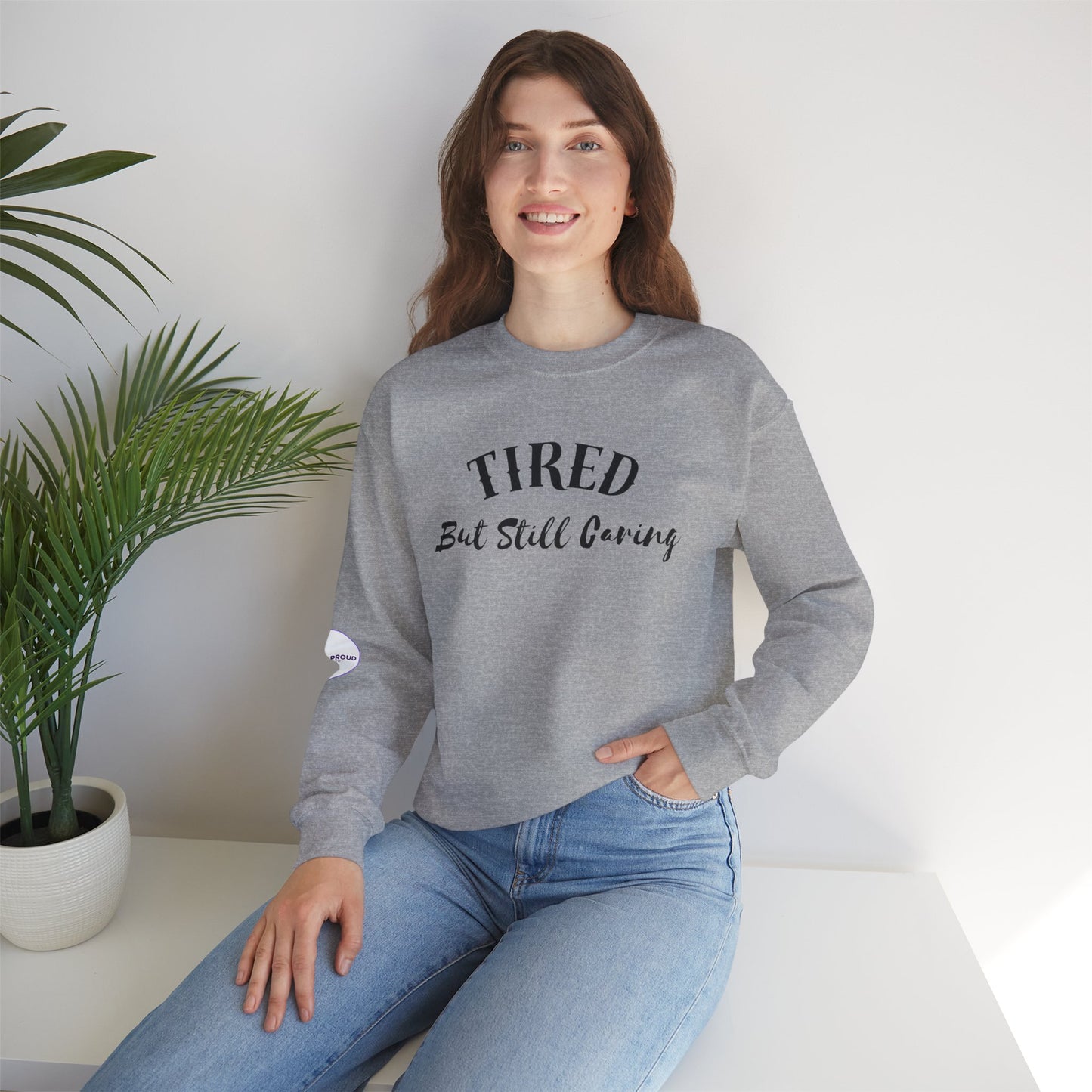 Tired But Still Caring Sweatshirt with midweight cotton-poly blend fabric