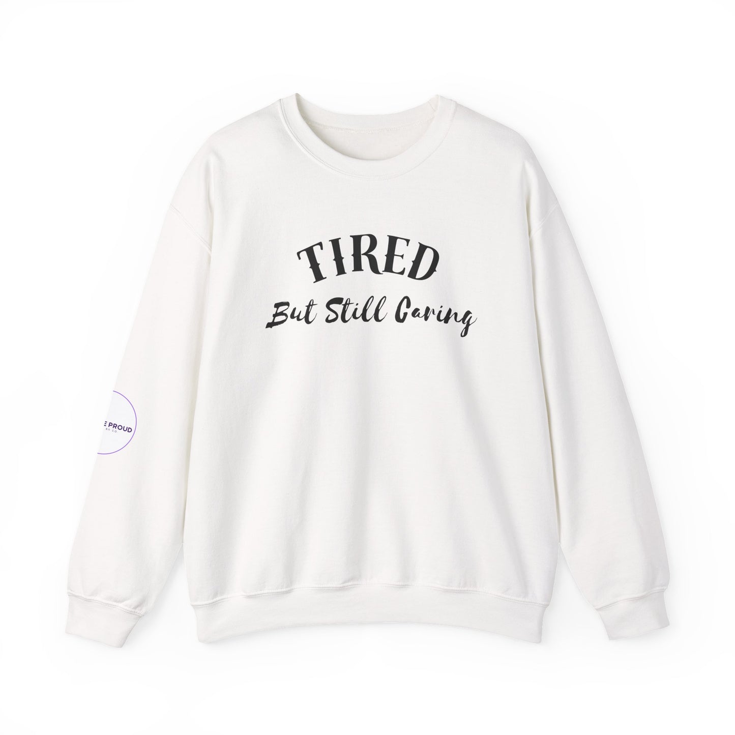 Front view of Tired But Still Caring Sweatshirt with simple type design