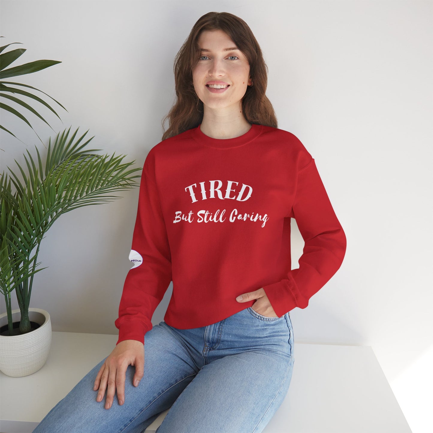 Tired But Still Caring Sweatshirt with midweight cotton-poly blend fabric