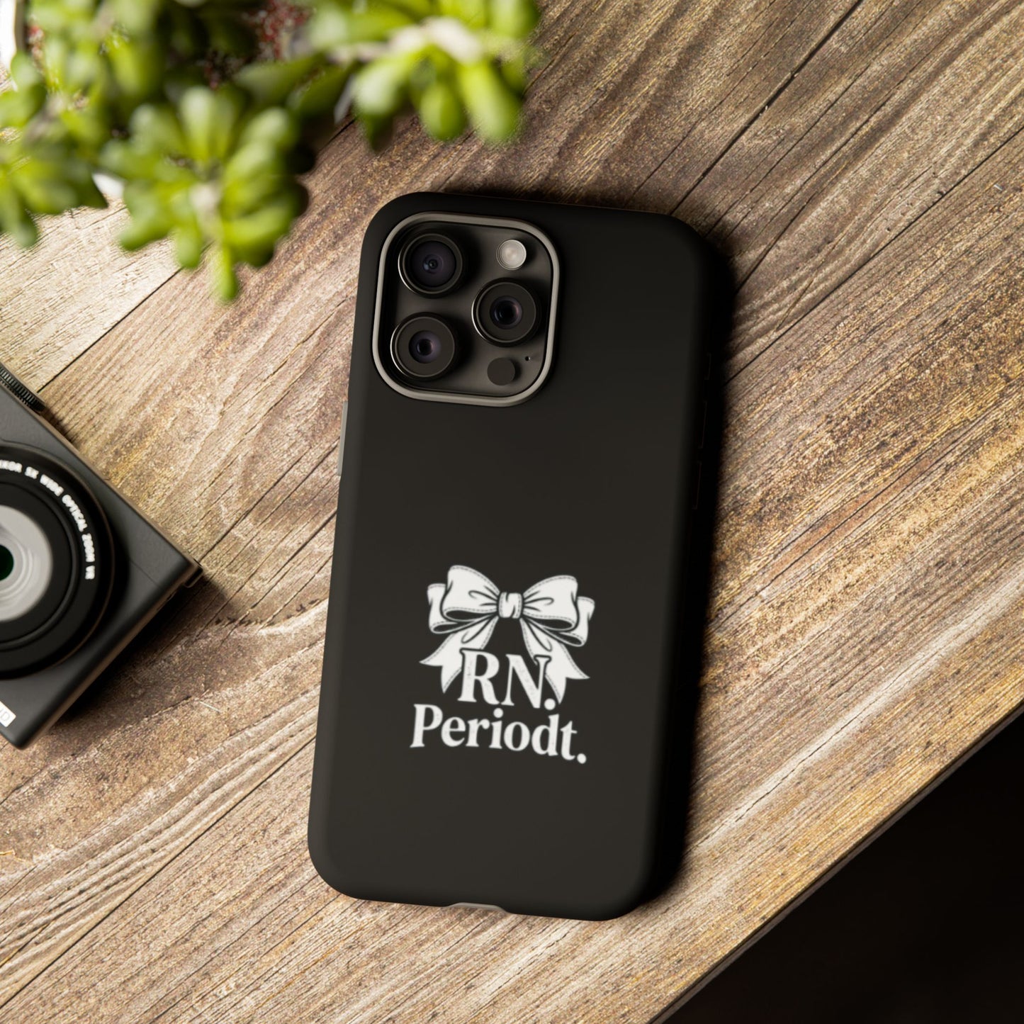 RN Phone Case with bold white bow graphic and text “RN. Periodt.” on a matte black background.