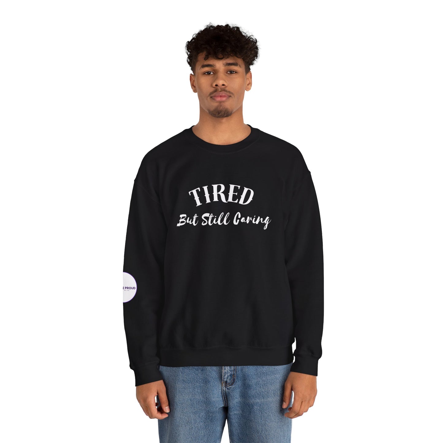 Front view of Tired But Still Caring Sweatshirt with simple type design