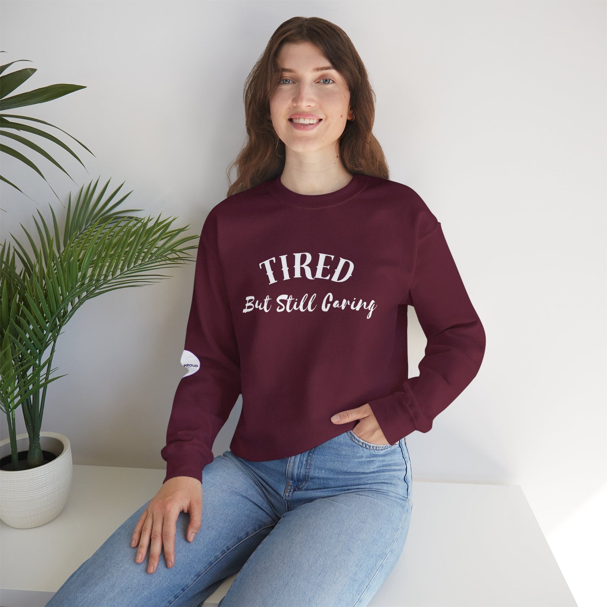 Tired But Still Caring Sweatshirt with midweight cotton-poly blend fabric