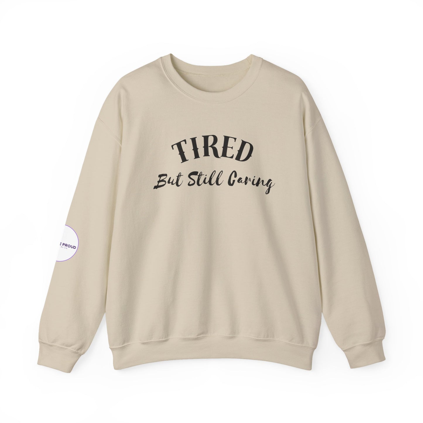 Close-up of the "Tired, But Still Caring" graphic on Tired But Still Caring Sweatshirt