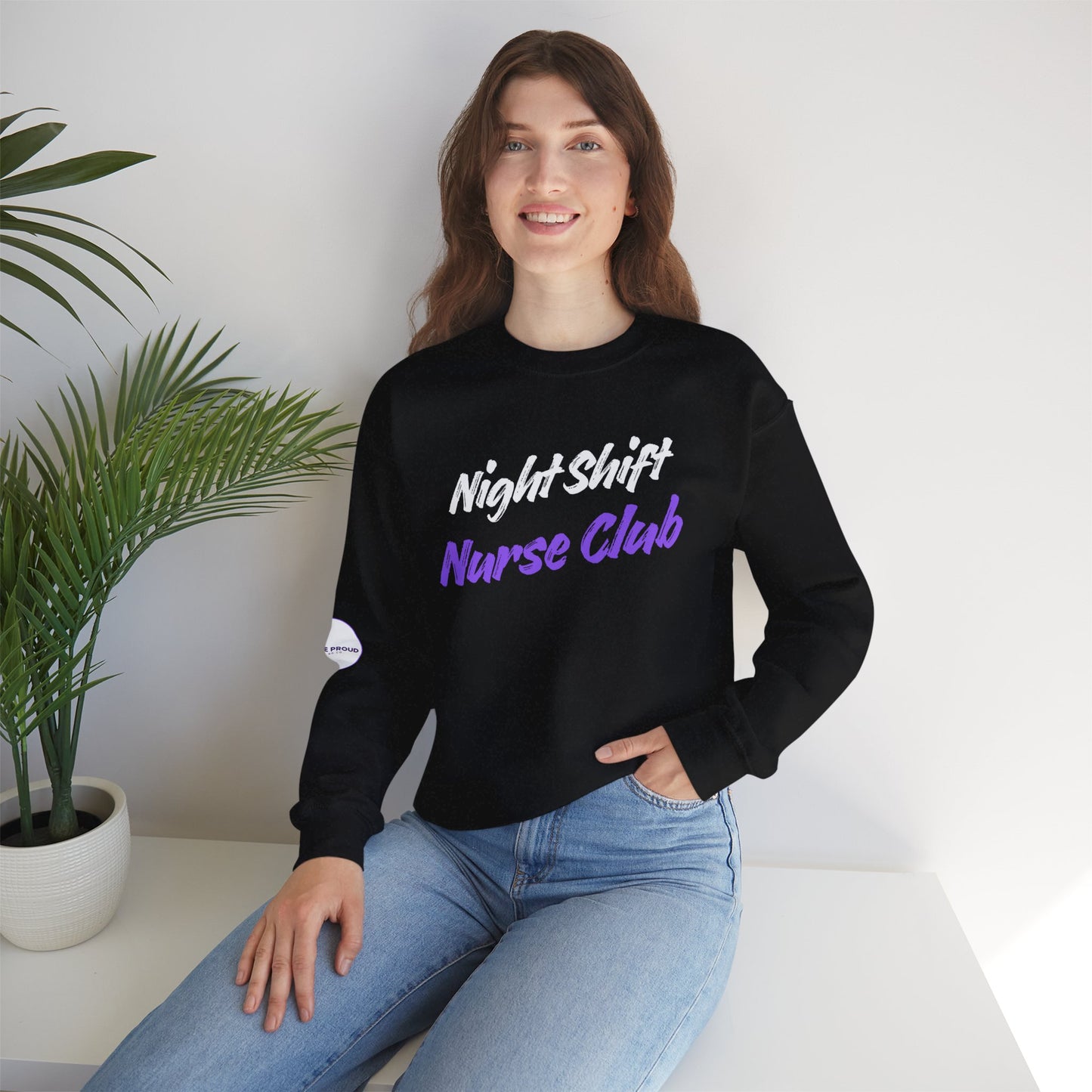 Night Shift Nurse Sweatshirt with embroidered purple lettering