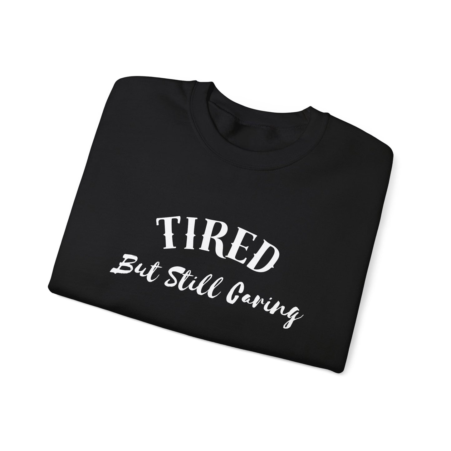 Front view of Tired But Still Caring Sweatshirt with simple type design