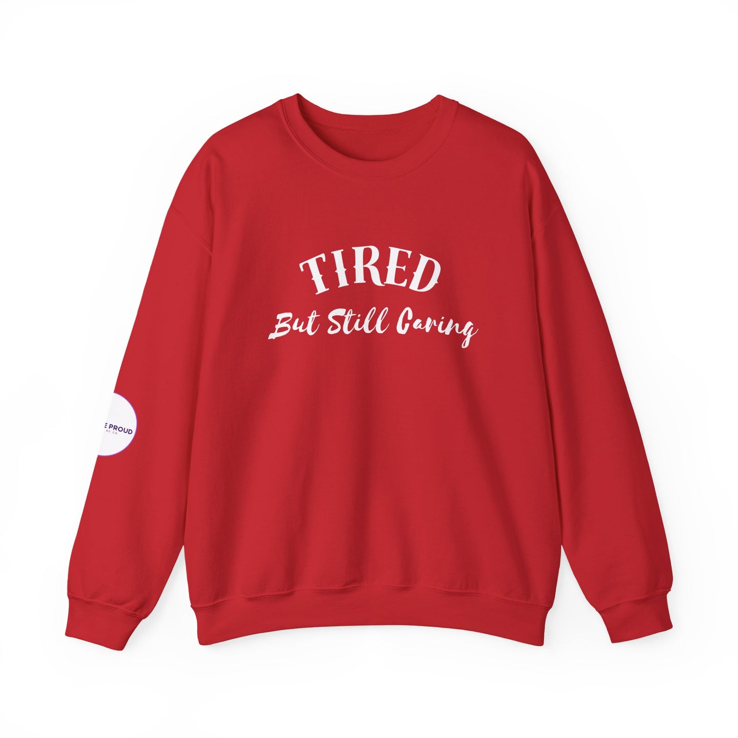 Side view of Tired But Still Caring Sweatshirt showcasing sleeve embroidery