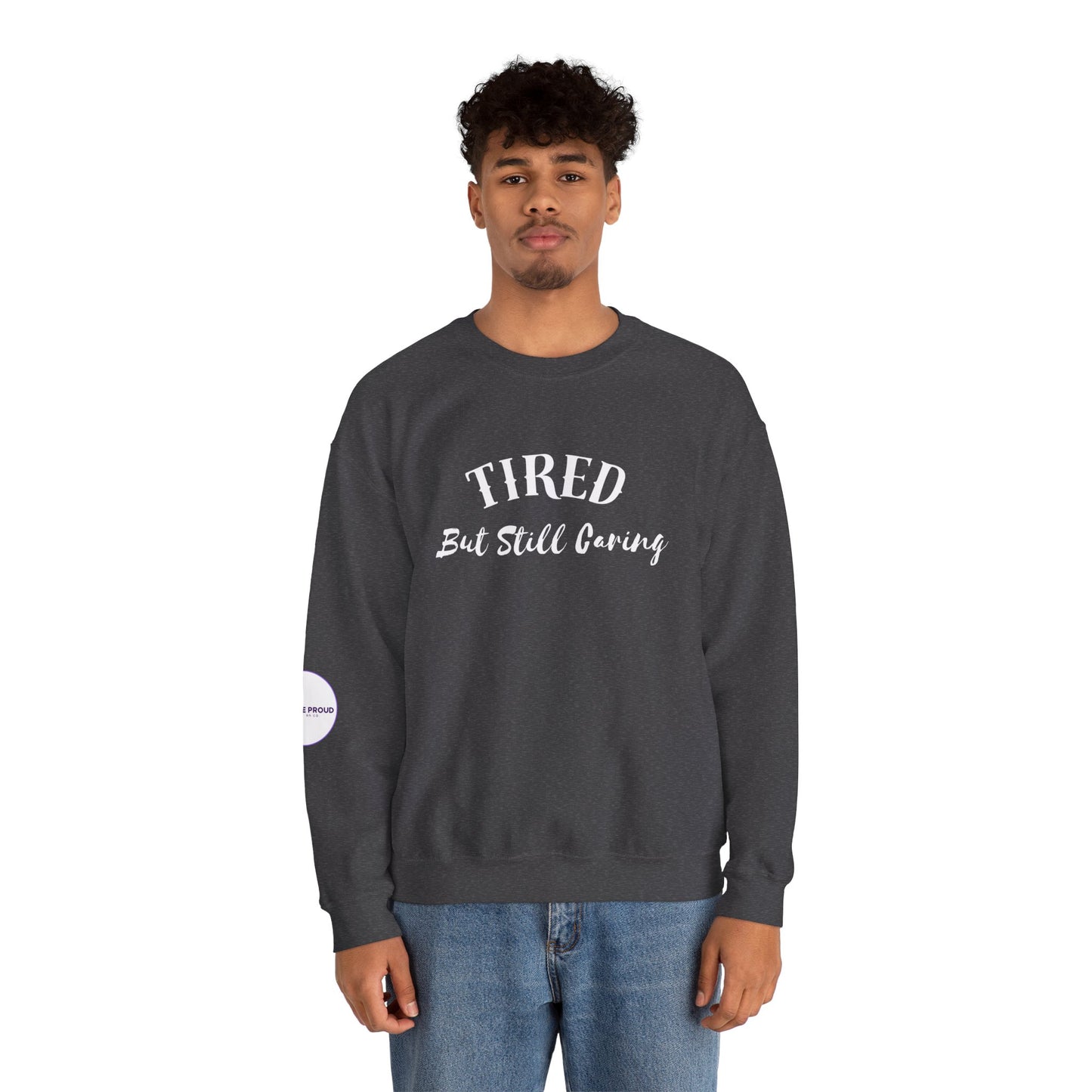 Front view of Tired But Still Caring Sweatshirt with simple type design