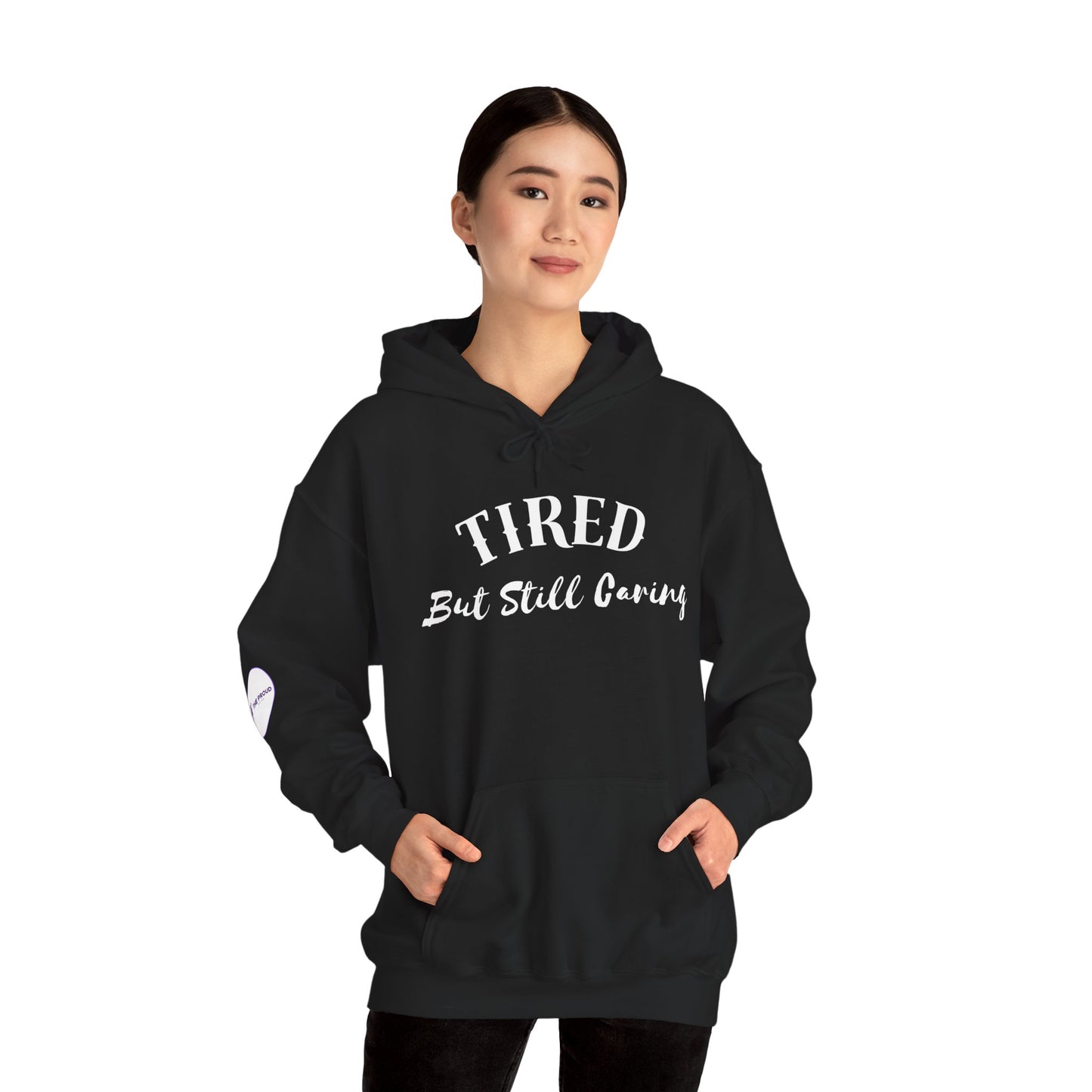 Tired But Still Caring Hoodie soft fleece sweatshirt with quote design