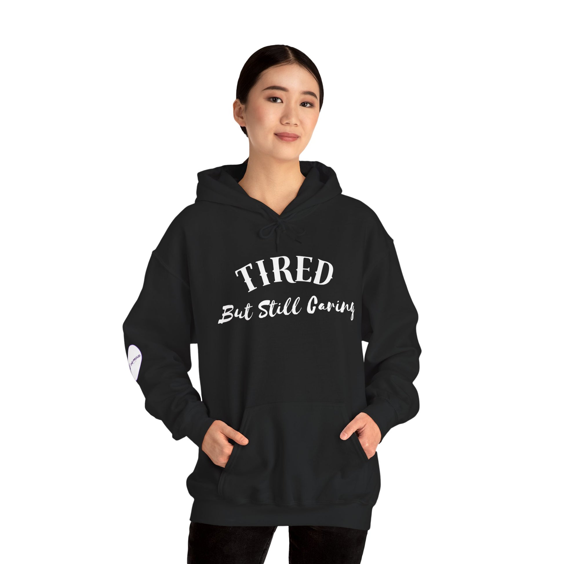 Tired But Still Caring Hoodie soft fleece sweatshirt with quote design